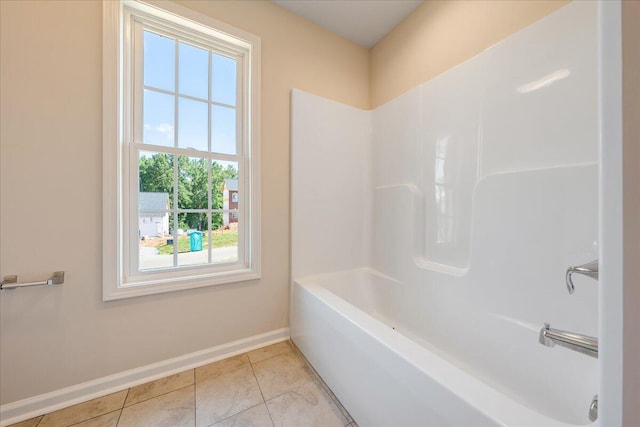 bathroom with tile patterned flooring and  shower combination