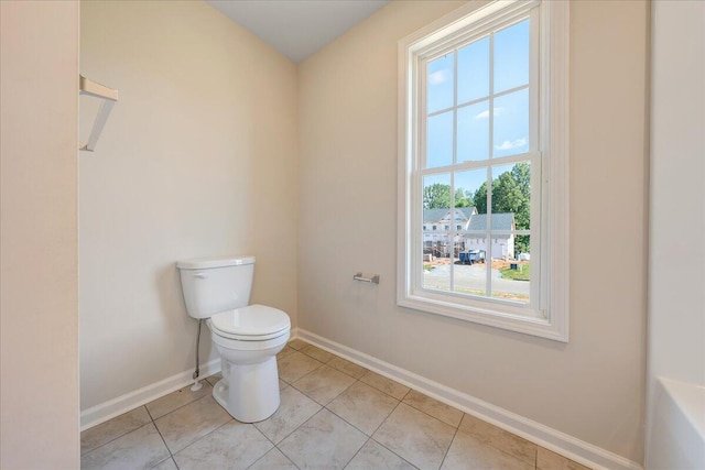 bathroom with tile patterned flooring and toilet