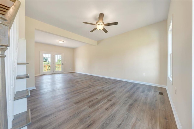 unfurnished living room with ceiling fan and light wood-type flooring