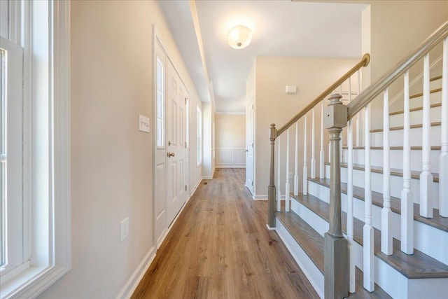 foyer featuring a healthy amount of sunlight and light hardwood / wood-style floors