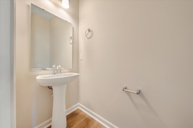 bathroom with wood-type flooring