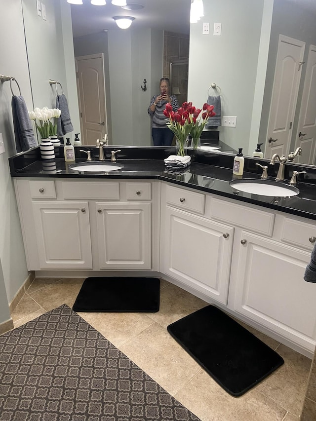 bathroom with tile patterned flooring and vanity