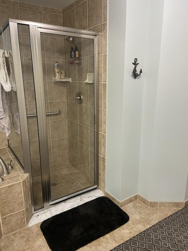 bathroom featuring shower with separate bathtub and tile patterned floors