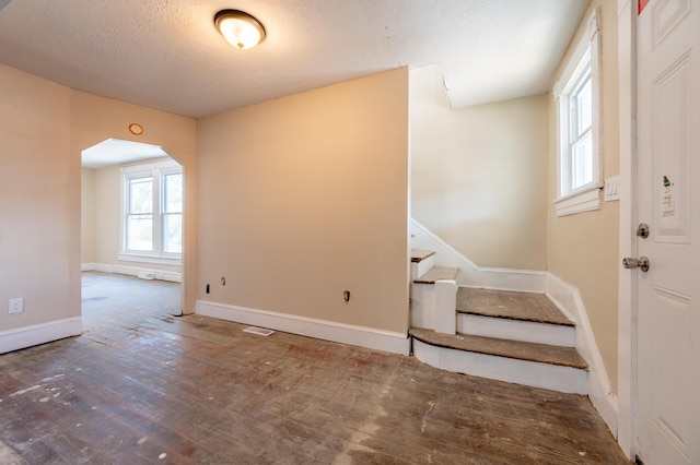 entryway featuring a textured ceiling