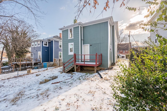 view of snow covered house