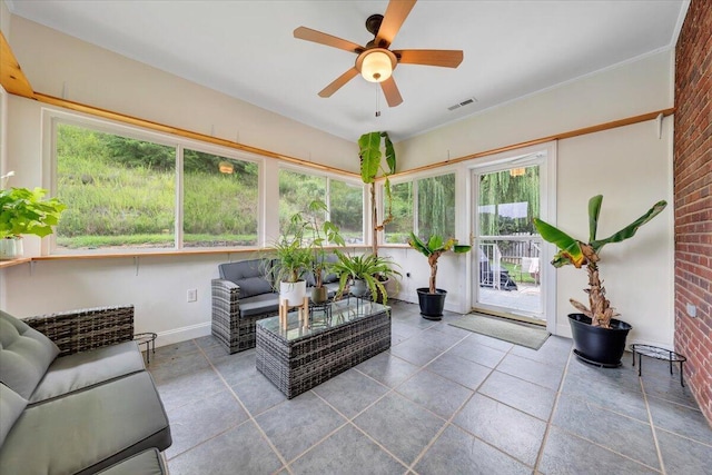 sunroom with ceiling fan