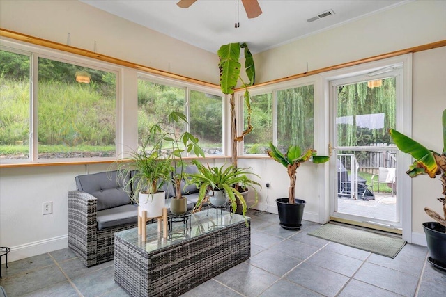 sunroom / solarium with ceiling fan