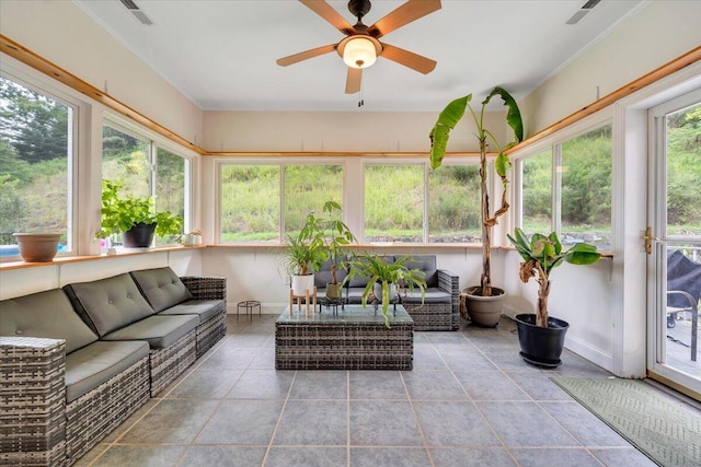 sunroom with ceiling fan