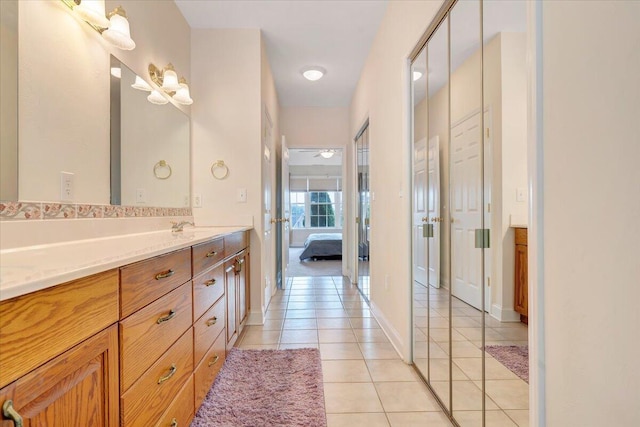 bathroom with vanity and tile patterned flooring