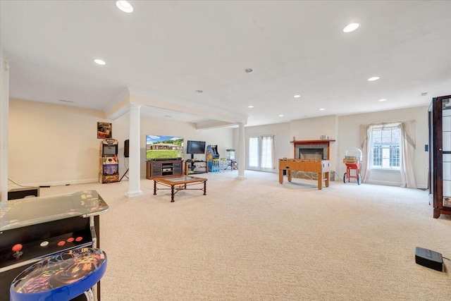 recreation room with light colored carpet and ornate columns