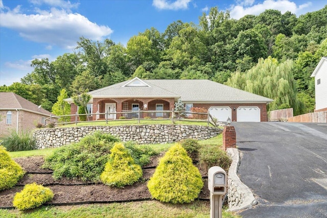 single story home with a garage