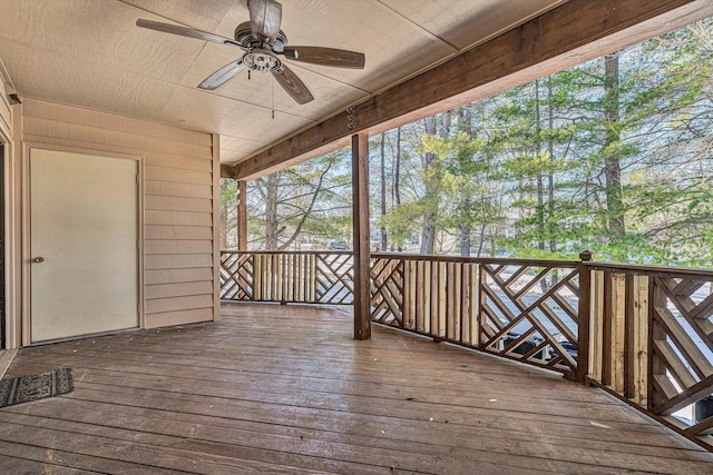 wooden deck featuring ceiling fan