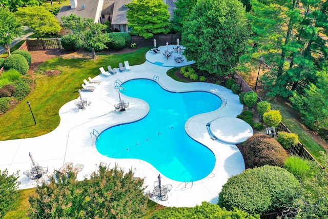 view of pool with a lawn and a patio area