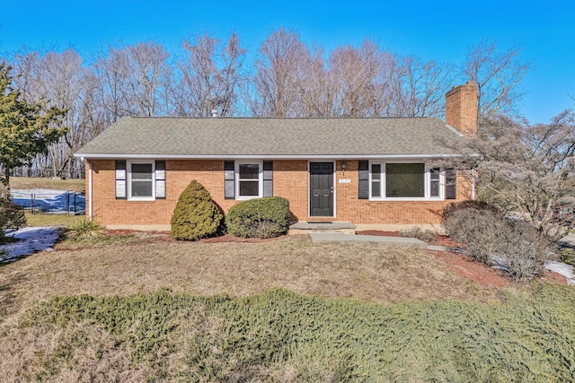 single story home with a front lawn