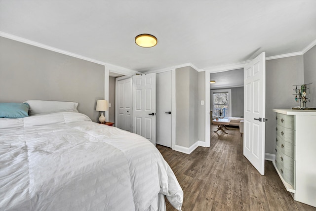 bedroom featuring crown molding and dark hardwood / wood-style floors