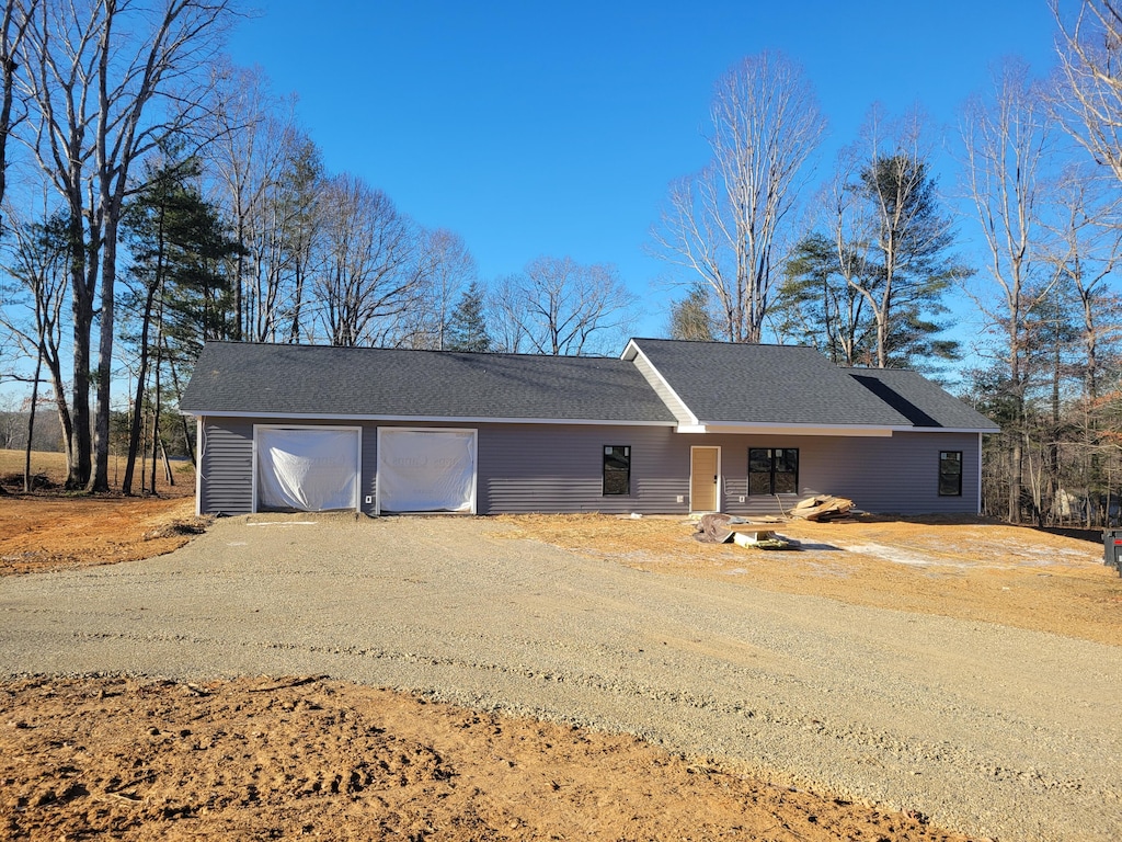 ranch-style home featuring a garage