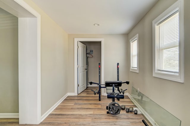 workout room with light hardwood / wood-style floors