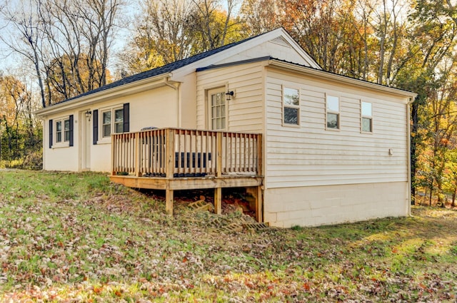 exterior space with a yard and a deck