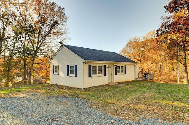 view of property exterior with a lawn