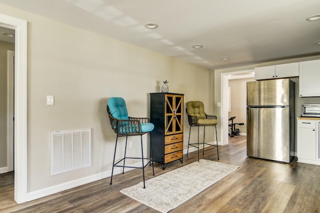 living area with dark hardwood / wood-style floors