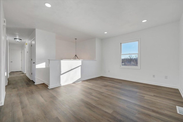 unfurnished room featuring dark hardwood / wood-style flooring