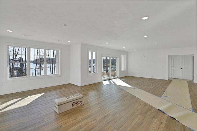 unfurnished living room featuring light wood-type flooring