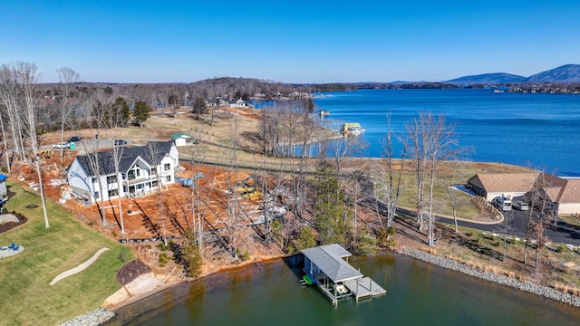 birds eye view of property featuring a water and mountain view