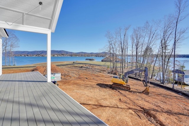 view of yard featuring a water and mountain view