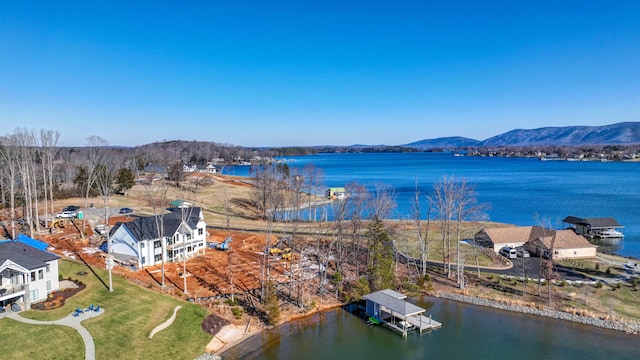 view of water feature featuring a dock and a mountain view