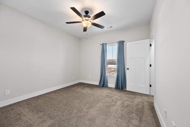 carpeted empty room with ceiling fan