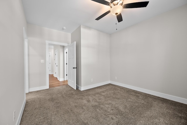 empty room featuring carpet and ceiling fan