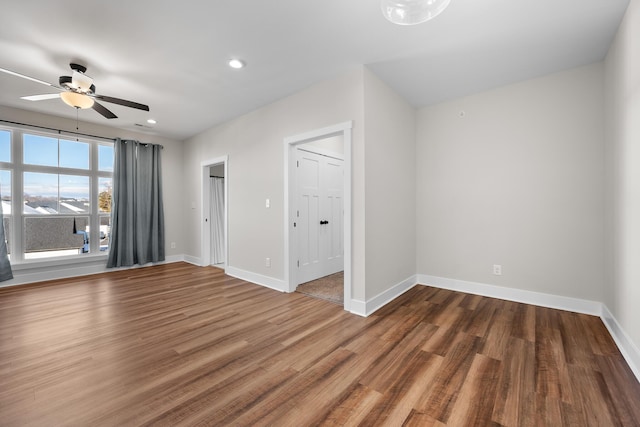 unfurnished room featuring ceiling fan and wood-type flooring