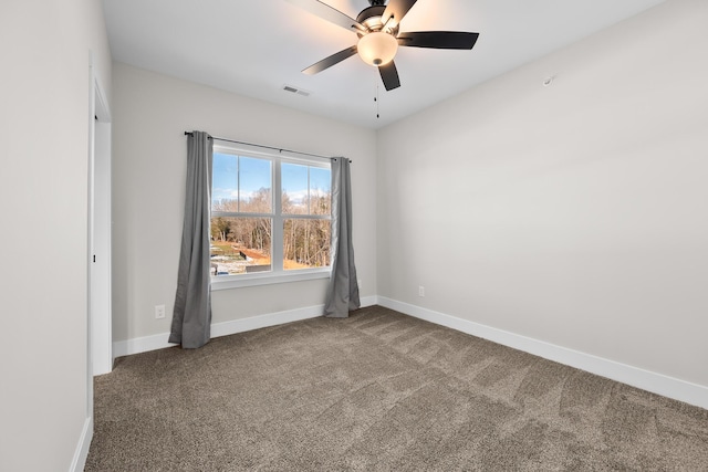 empty room featuring carpet flooring and ceiling fan