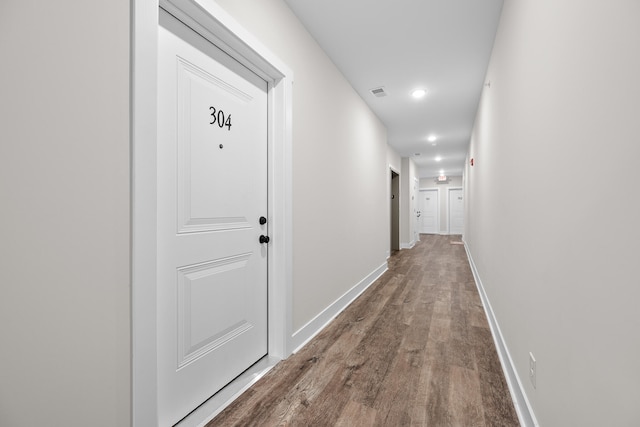 corridor featuring hardwood / wood-style floors