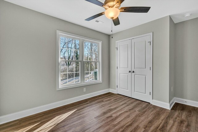 full bathroom with shower / bath combination, vanity, hardwood / wood-style flooring, and toilet