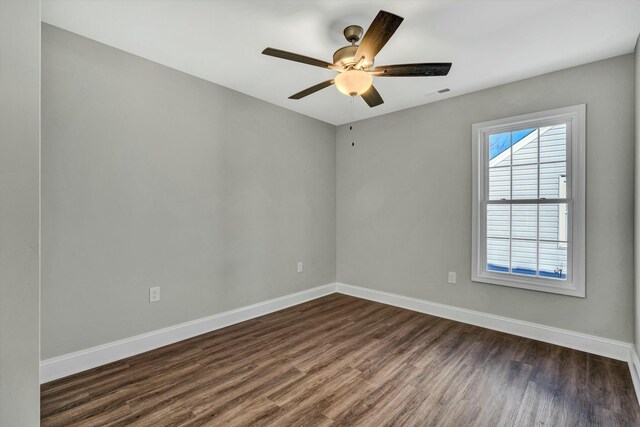 unfurnished bedroom featuring dark hardwood / wood-style flooring, a closet, and ceiling fan