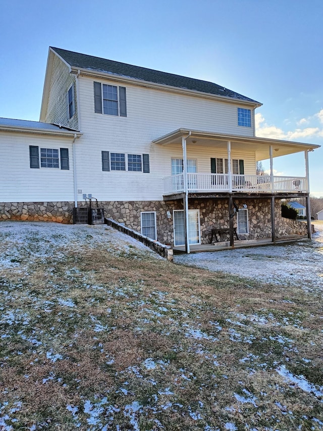 back of property with central air condition unit and a wooden deck