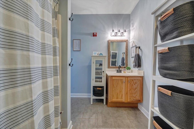 bathroom with tile patterned flooring and vanity