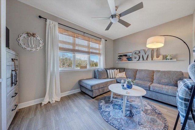 living room featuring hardwood / wood-style flooring and ceiling fan