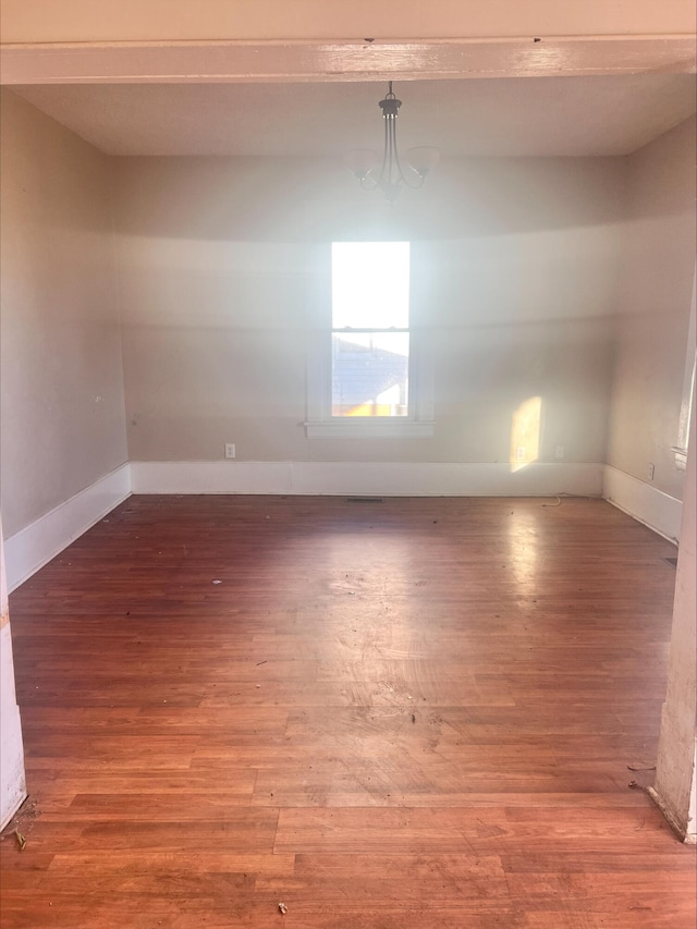 spare room featuring hardwood / wood-style floors