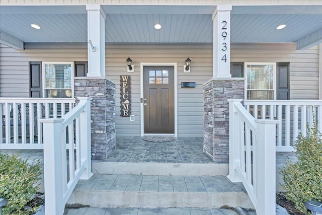 property entrance featuring covered porch