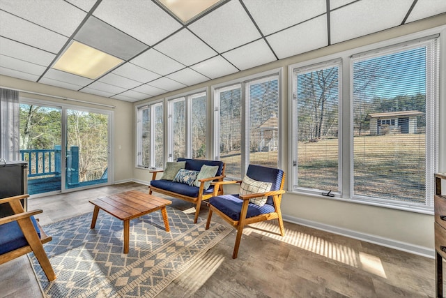 sunroom featuring a drop ceiling