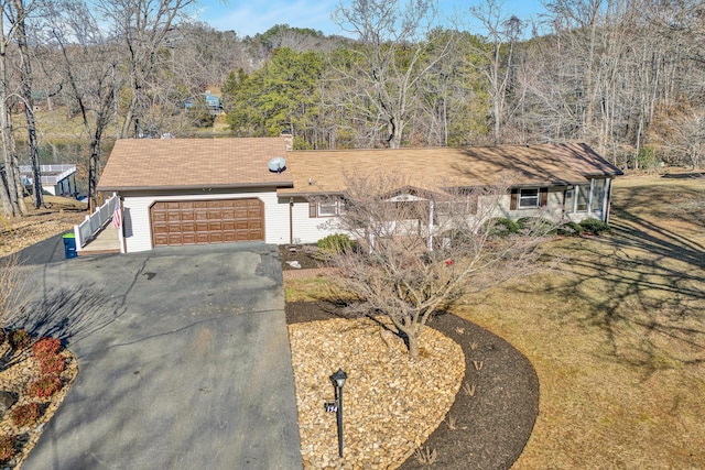 single story home featuring a garage