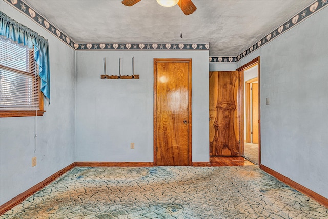 unfurnished bedroom featuring ceiling fan