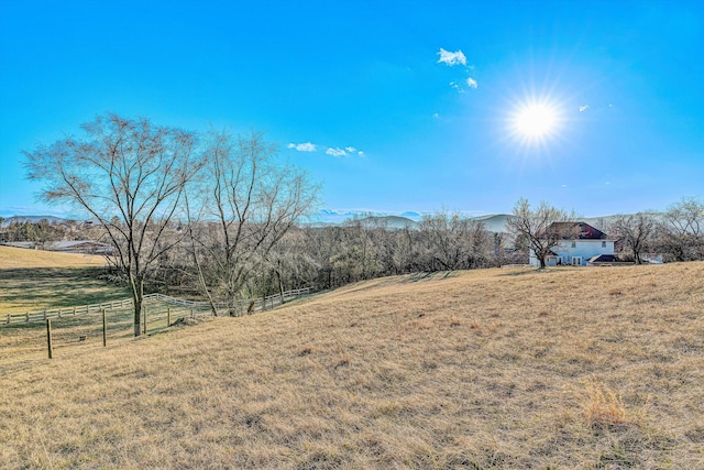 view of yard with a rural view