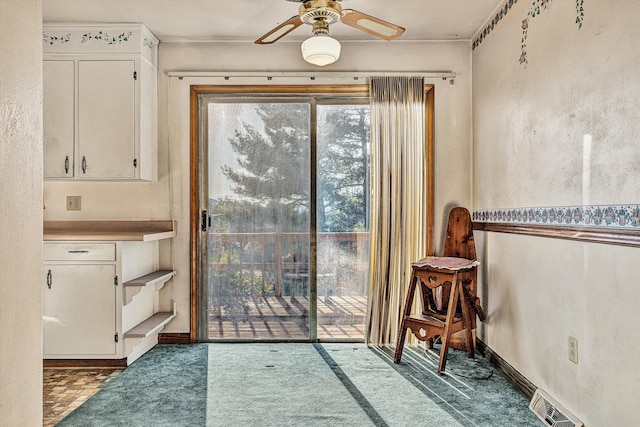 doorway to outside featuring ceiling fan