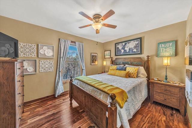 bedroom featuring ceiling fan and dark hardwood / wood-style flooring