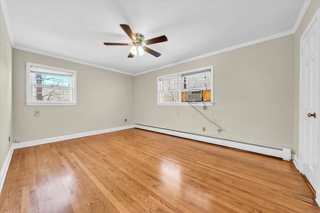 spare room with light hardwood / wood-style floors, a baseboard radiator, and ornamental molding