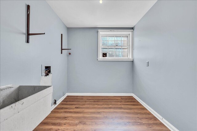 unfurnished living room featuring a wealth of natural light, built in features, beam ceiling, and wooden walls