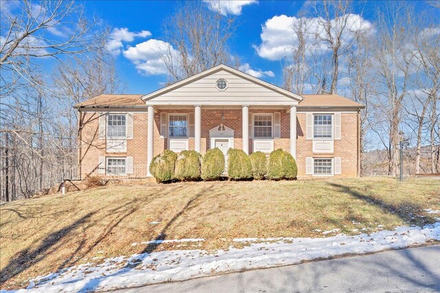 view of front of house with a front lawn and a porch